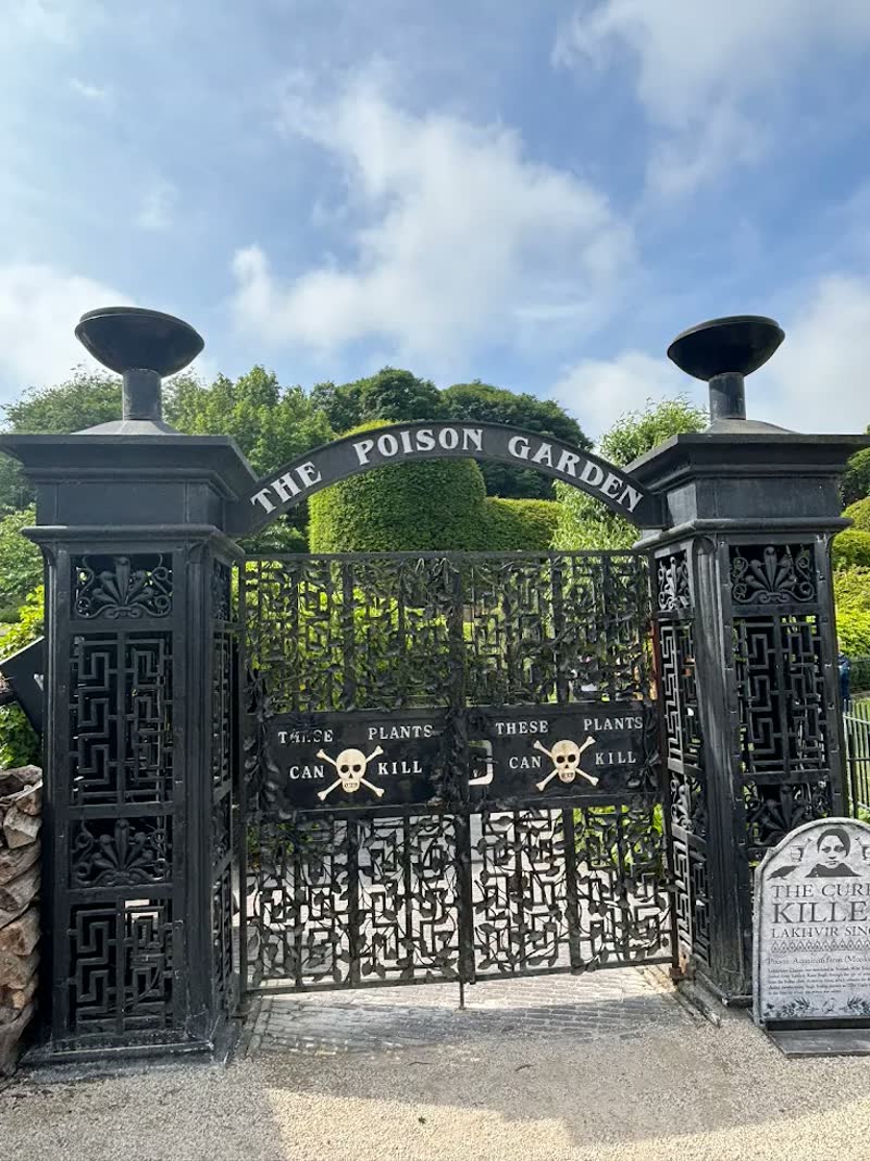Iron gates of The Alnwick Garden Poison Garden with golden skull motifs